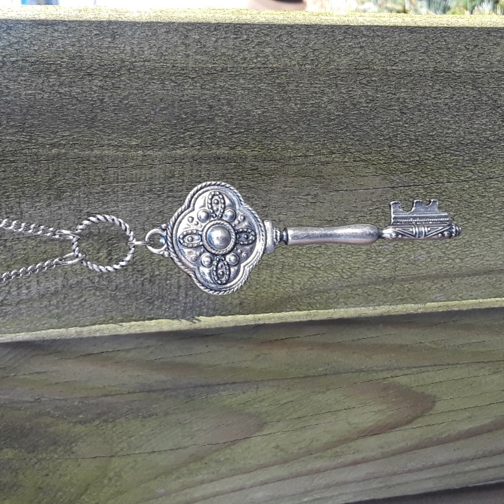 Silver key pendant necklace.